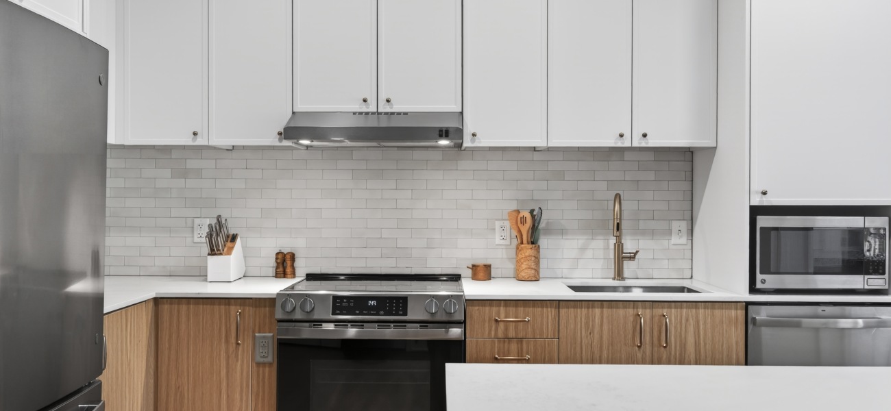 Modern kitchens with white cabinets and stainless steel appliances